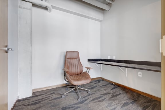 a workspace with a chair and a desk