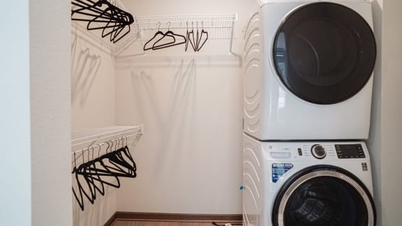 a washing machine and dryer in a laundry room