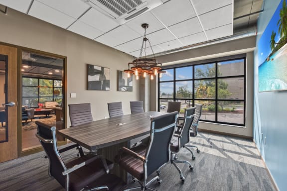 a conference room with a large table and chairs