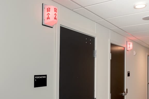 A sign on a door reads "RAIL".