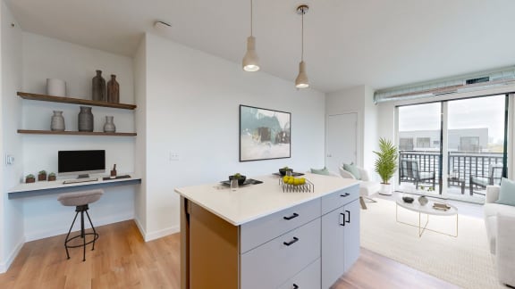a kitchen with an island and a living room with a balcony at Tyler Street Stacks, Minnesota, 55413