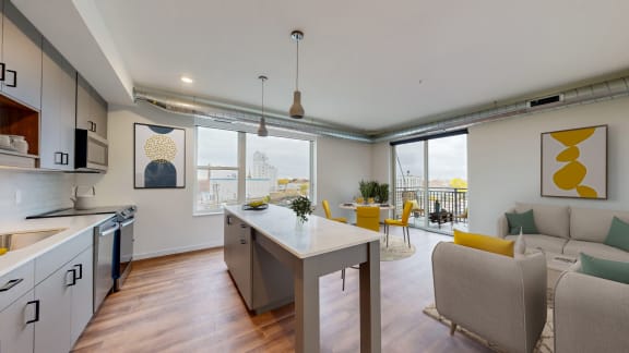 a living room with a kitchen and a dining room