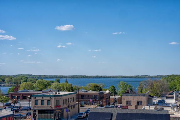 A view of downtown Waconia with a lake in the background.