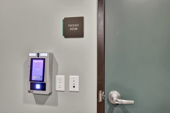 A door with a handle and a sign that says package room.
