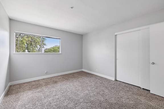 Spacious empty room with window at Ocean Villas Apartments, California, 93033
