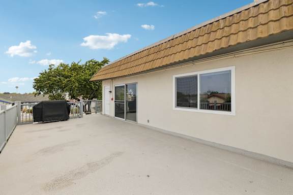 Balcony with glass door at Ocean Villas Apartments, California, 93033