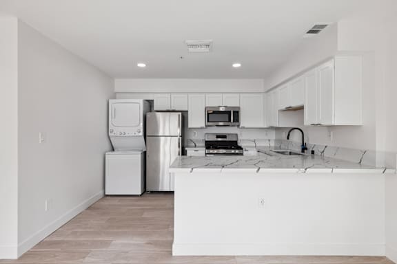 Kitchen with stove top oven at Ocean Villas Apartments, Oxnard, 93033
