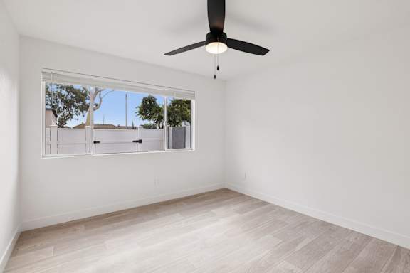 Unfurnished room with fan and window at Ocean Villas Apartments, Oxnard, CA