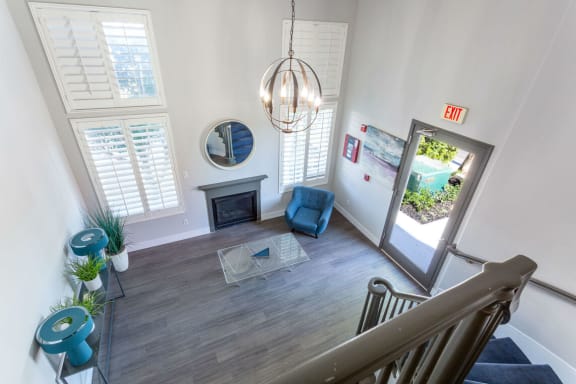 a view of a living room from the top of a staircase at Warner Center Townhomes, Canoga Park, CA