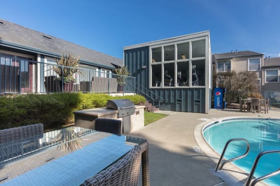 a pool with a hot tub and a house with a swimming pool  at Skyline Heights LLC, California, 94015