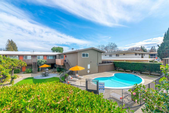 a backyard with a pool and a house with a swimming pool at Element LLC, Sunnyvale, CA, 94086