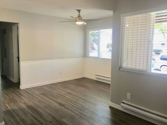 an empty living room with wood floors and a ceiling fan at Element LLC, Sunnyvale, CA