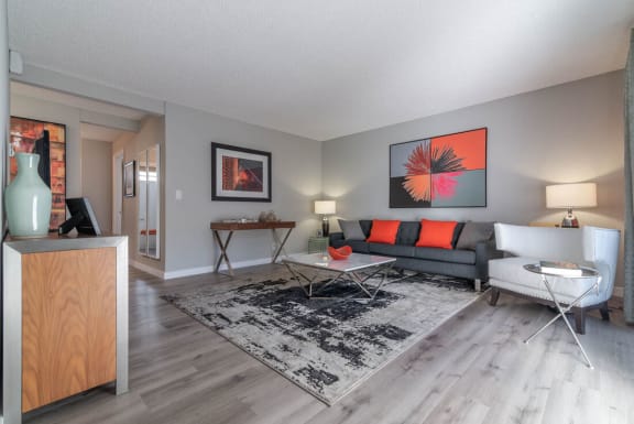 a living room with a couch and a tableat Sunnyvale Crossings Apartments, LLC, California