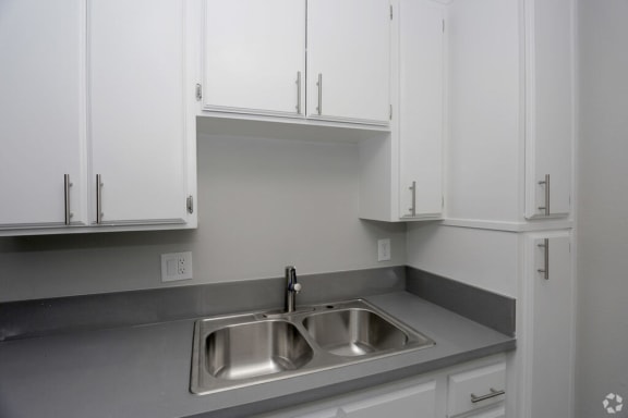 Sink With Faucet at The Marq Apartments LLC, Los Angeles, California