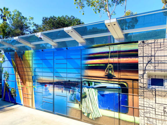 a bathroom with a colorful mural on the side of it at La Jolla Blue, California, 92122