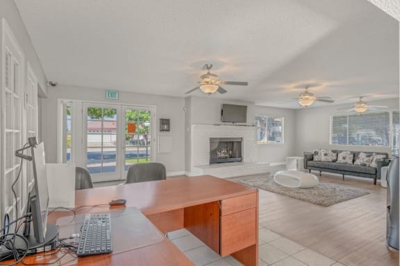 a living room with a desk and a fireplace at Ocean Villas, Oxnard California
