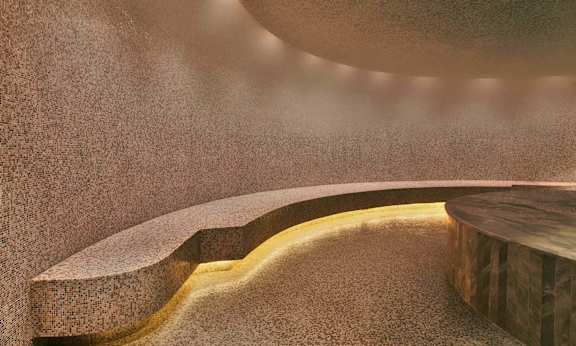 a close up of a stone wall with a ray of light on it at SKY Apartments, New York, NY, 10036