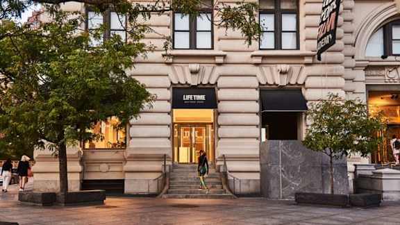 A building with a black awning and a sign that says Lifetime  at One West, New York
