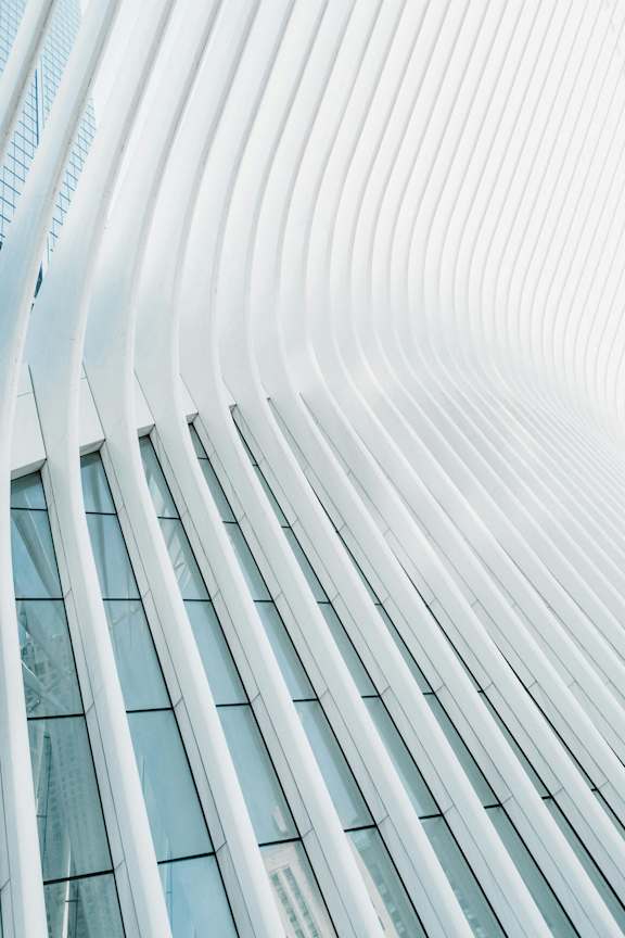 A modern building with a white exterior and curved lines. at SKY Apartments, New York