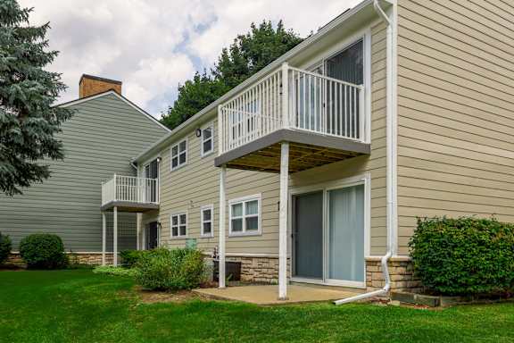 A house with a balcony and a door.
