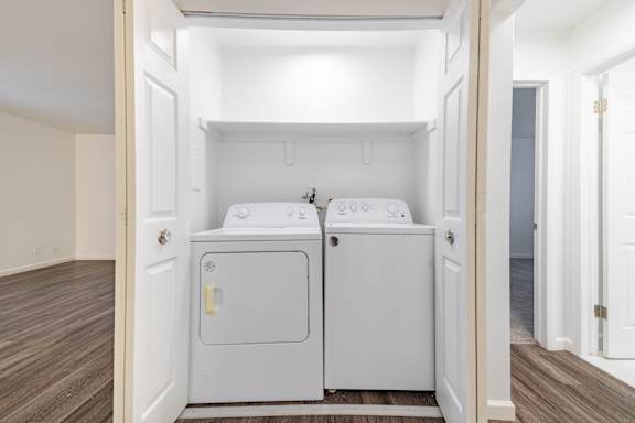A small laundry room with a washer and dryer.