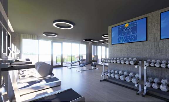 A modern room with a large screen displaying the time and date.