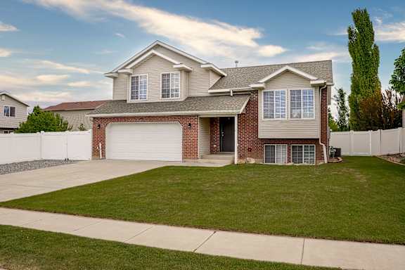 A house with a garage and a driveway.