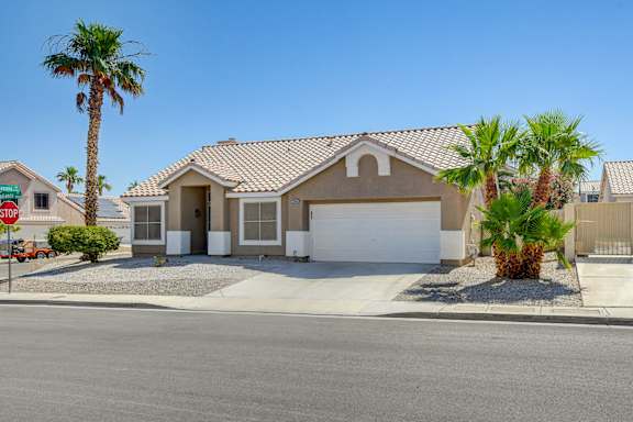 A house with a brown roof and a white garage door.
