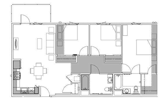A floor plan of a house with a kitchen, living room, and bedrooms.