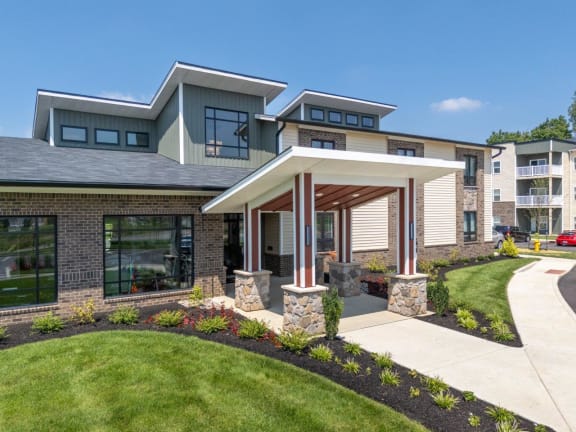 a home with a sidewalk in front of it