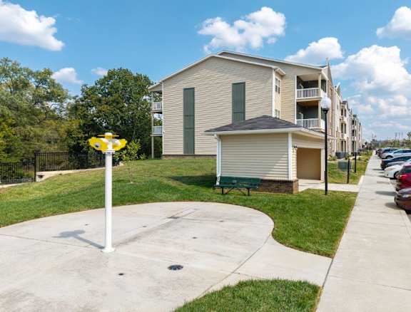 A residential area with apartment buildings and a street sign.