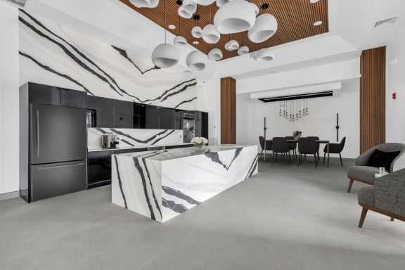 a kitchen with a marble island in the middle of it at The Franklin Marlboro Apartments, Marlboro, NJ 07746