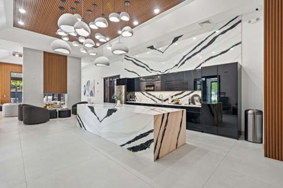Modern lobby with marble reception desk at The Franklin at Marlboro Apartments, New Jersey