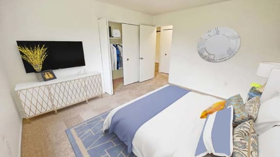 a bedroom with a bed and a tv in it