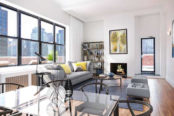 A modern living room with a glass table and a grey couch. at Sutton Collection Apartments, New York, NY, 10022