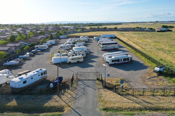a group of rvs parked in a parking lot