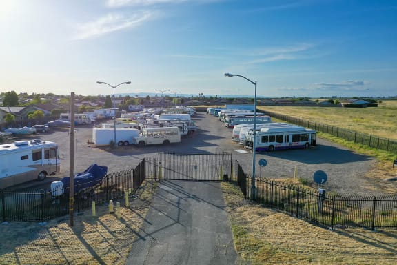 a group of buses parked in a parking lot