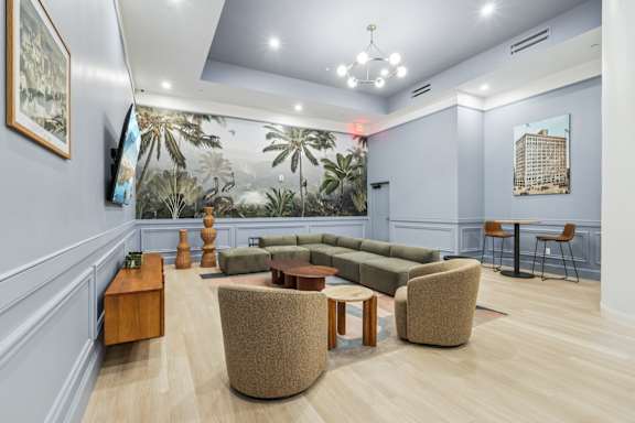 A living room with a couch, chairs, and a coffee table. at LiveWell Apartments, Pittsburgh, PA, 15222
