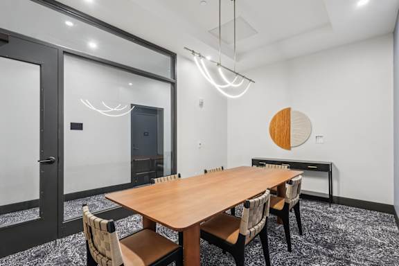 A conference room with a long table and chairs at LiveWell Apartments, Pennsylvania, 15222
