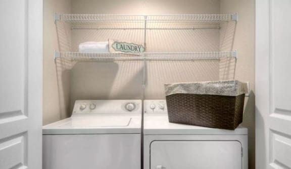 In-home laundry room with washer and dryer connections