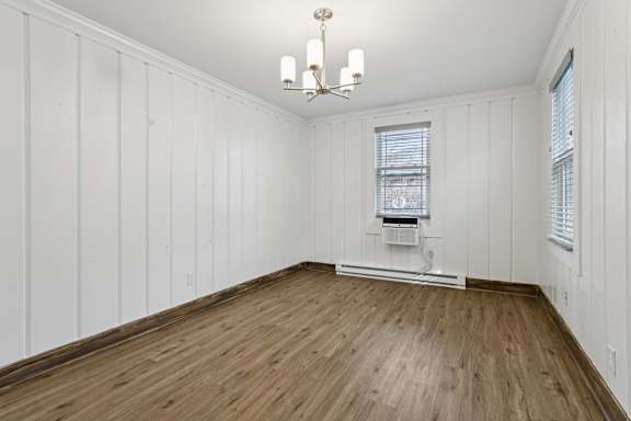 A room with wooden floors and white walls. at Shipyard Shores Apartments, Virginia, 23607