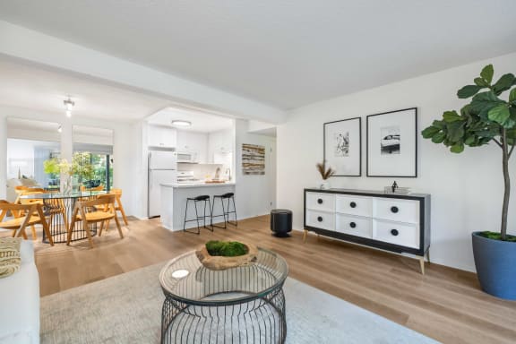 an open living room with a dining room and a kitchen