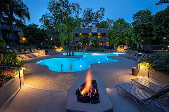 A pool with a fire pit in the middle of it.at The Aspens South Coast, South Coast Metro