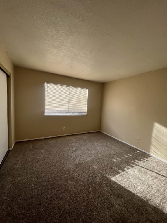 an empty room with a window in it