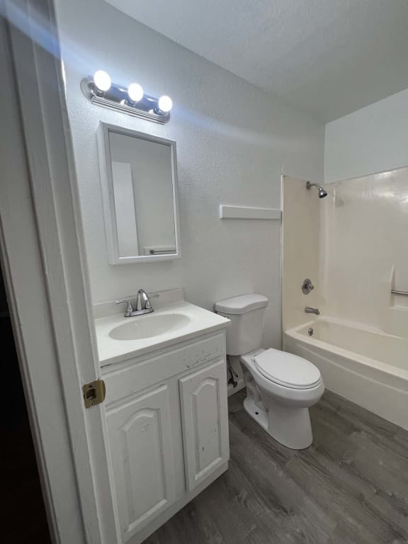 a bathroom with a sink toilet and a shower