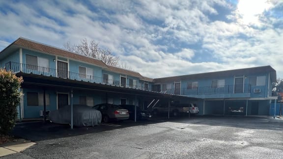 a building with cars parked in front of it