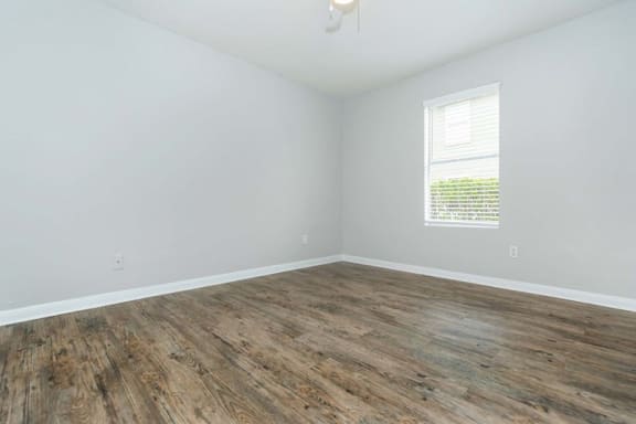 Royal Wildewood Manor wood inspired floors and a window