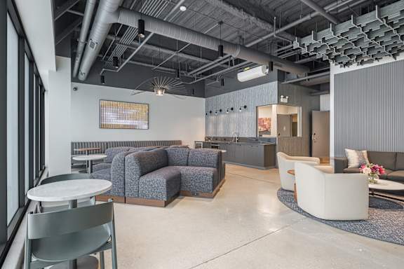 A modern office space with a grey and white color scheme.
