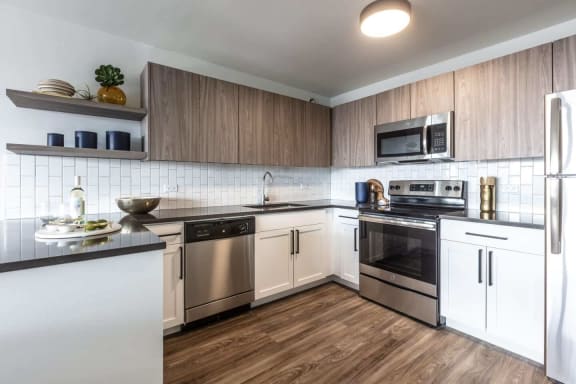 a kitchen with a wooden floor and