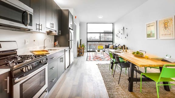 a kitchen and dining room with a table